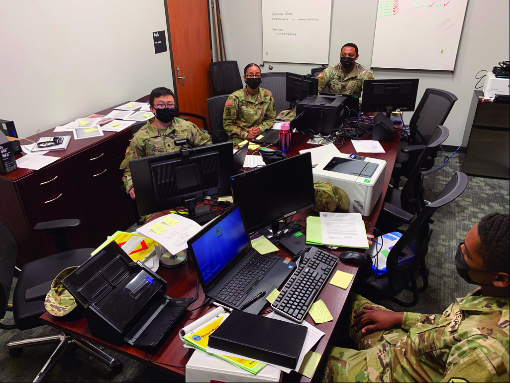 Military Justice paralegals at Fort Gordon, Georgia, working hard to complete all the panel nominations from across the installation and put it into a workable format to ensure efficiency in this aspect of the justice process. Left to right: SPC Jonathan Padios, SSG Taneshia Burley, SGT Aaron Diamond, PFC Tabius Monroe.